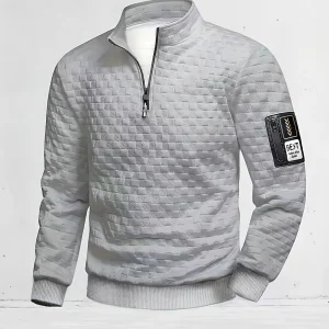Pull homme matelassé motif géométrique avec col montant zippé et patch manche