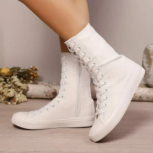 Bottes montantes type basket blanches à lacets et fermeture éclair latérale