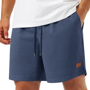 Pantalones cortos elegantes con estampado de gofre