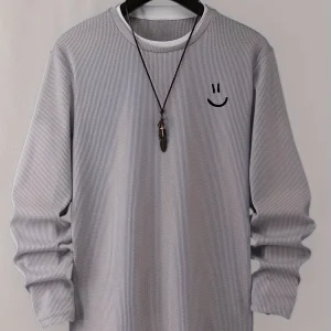 Pull homme texturé gaufré manches longues imprimé smiley col rond